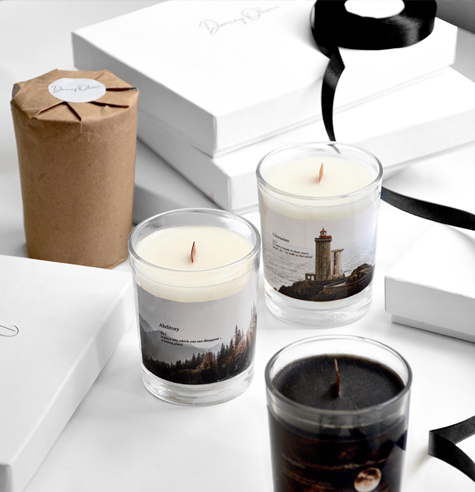 A selection of candles with custom labels applied the glass containers.