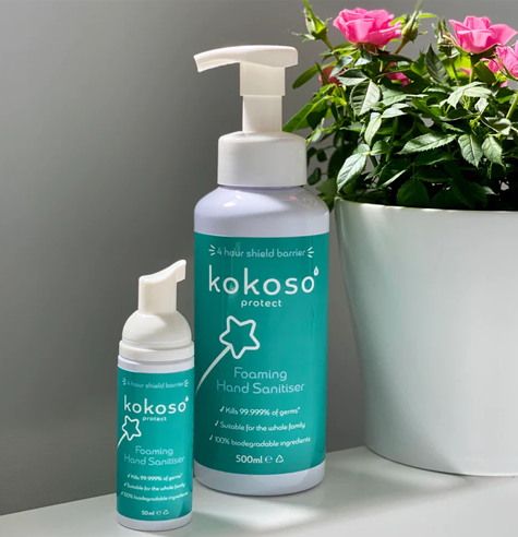 Two hand sanitiser bottles with custom vinyl product labels stuck to them.